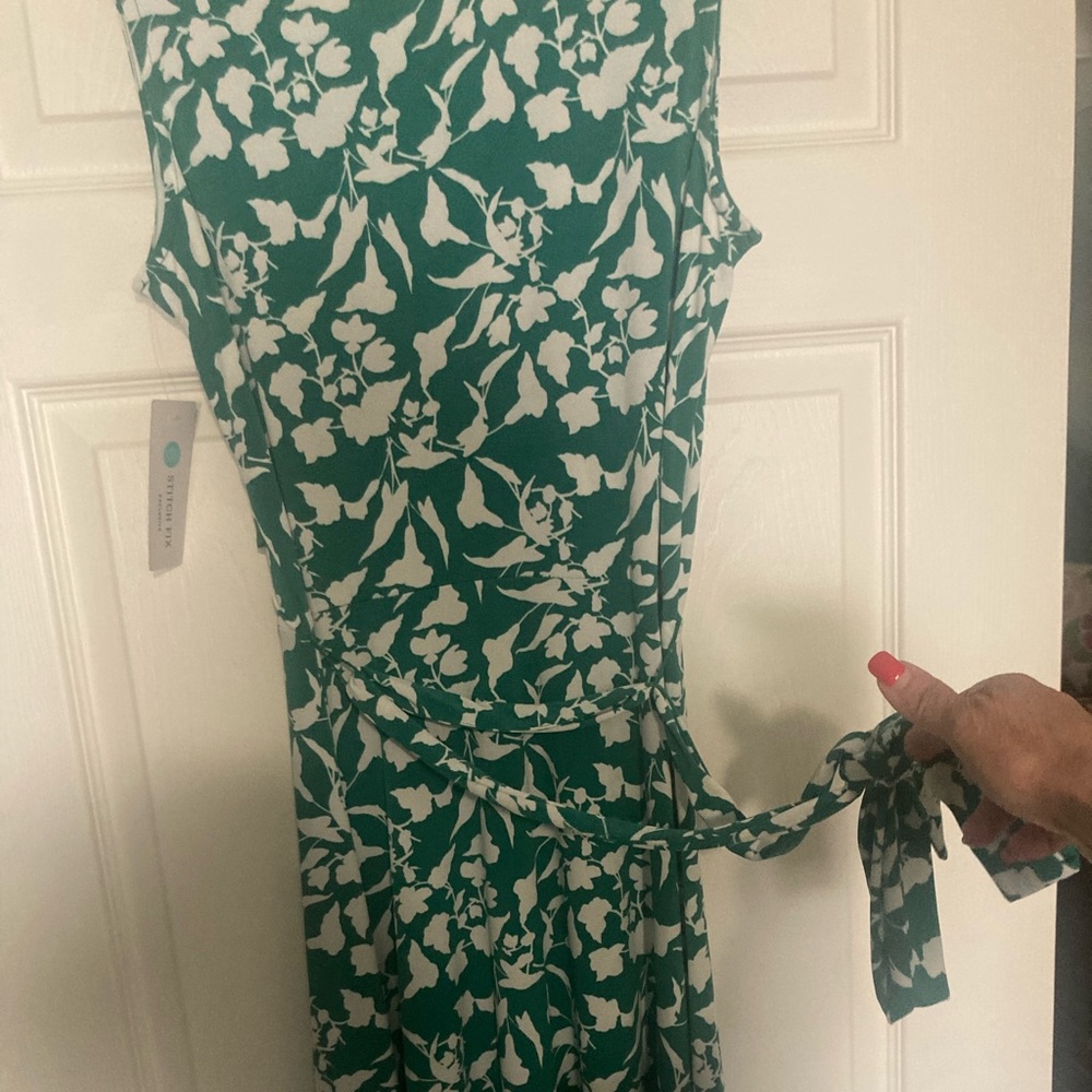 Wrap-around dress new with tags.  Green print.  Was $85.  Sz Sm.